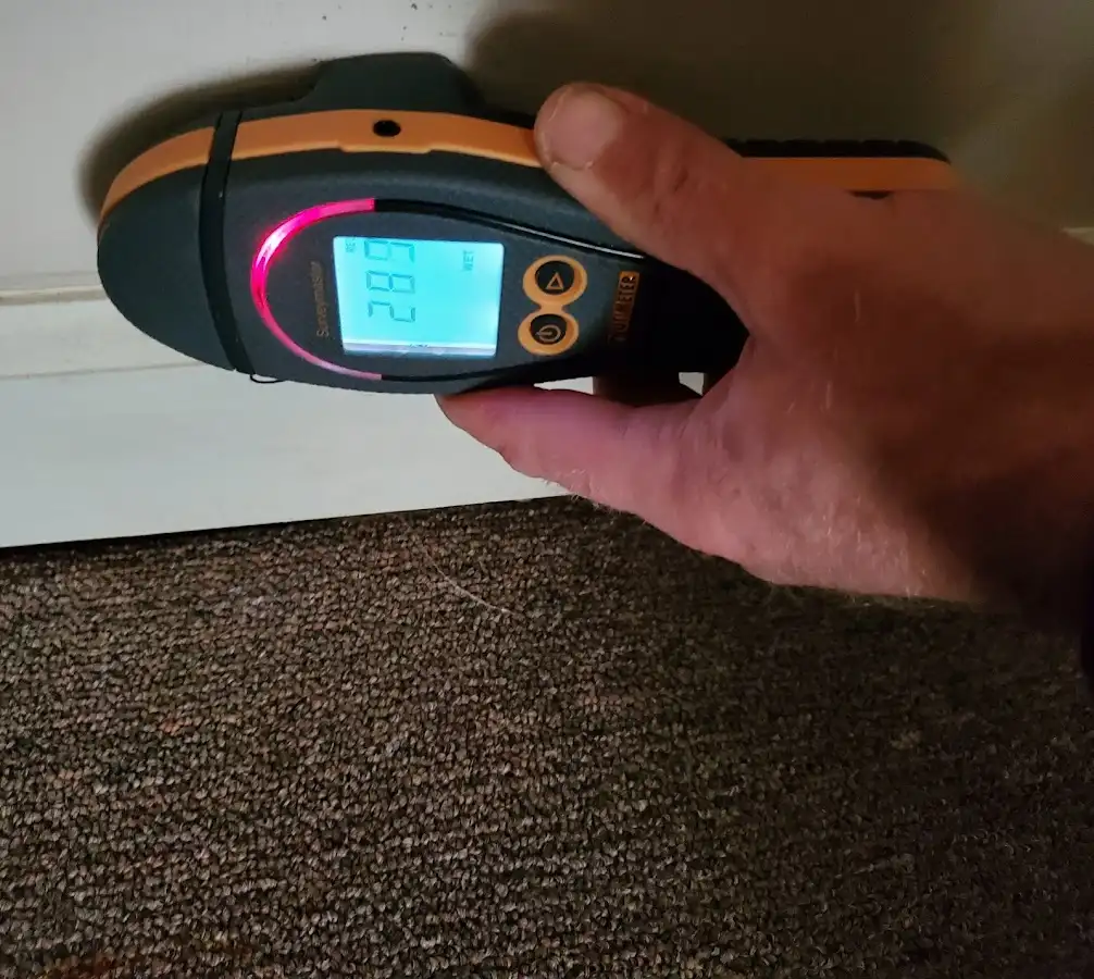 Moisture detection at baseboard during Sewage Cleanup & Sanitation in Hugo
